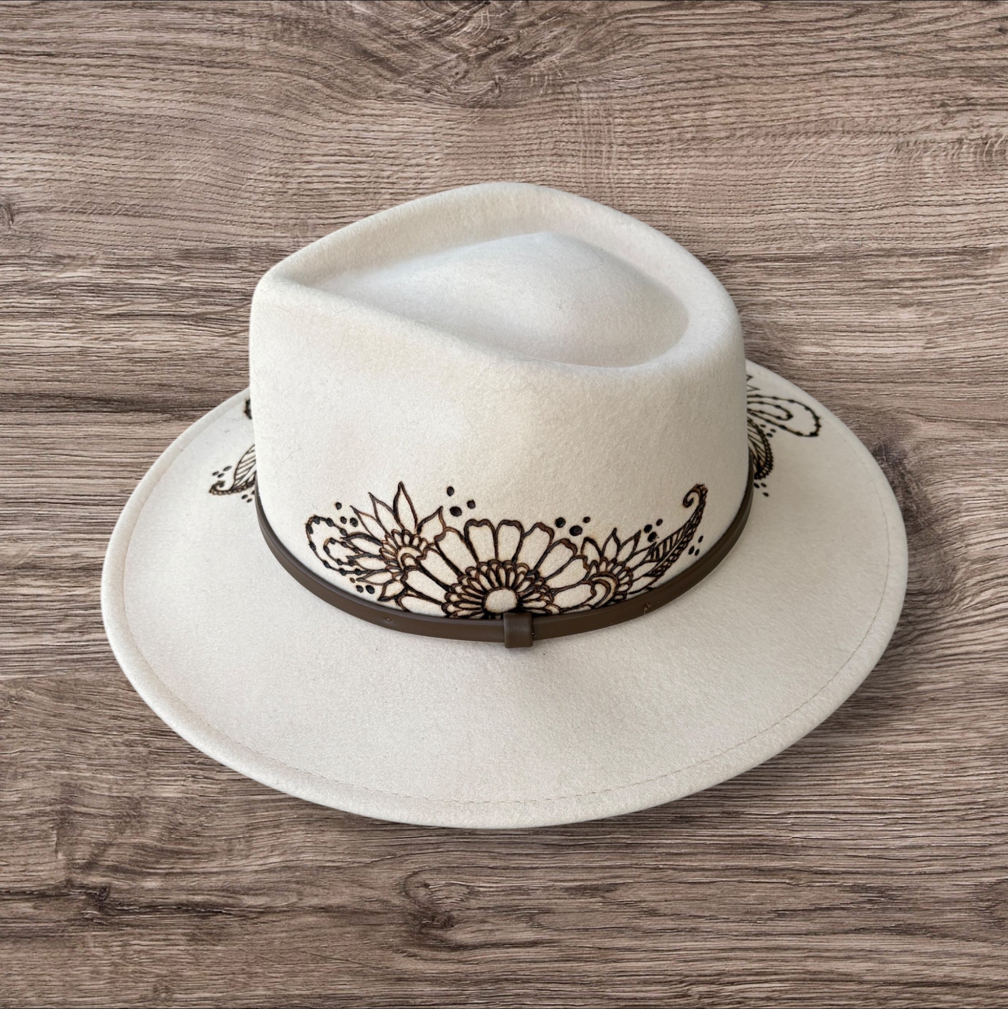 Oatmeal Fedora- 100% wool. Burnt Mandela with ‘be you, the world will adjust’ quote underneath brim.