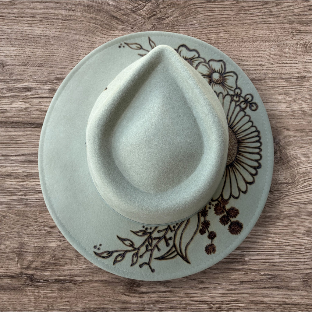 Mint Fedora - 100% wool. With pyrography flowers and  ‘Every flower blooms on its own time’ quote on underside of brim.