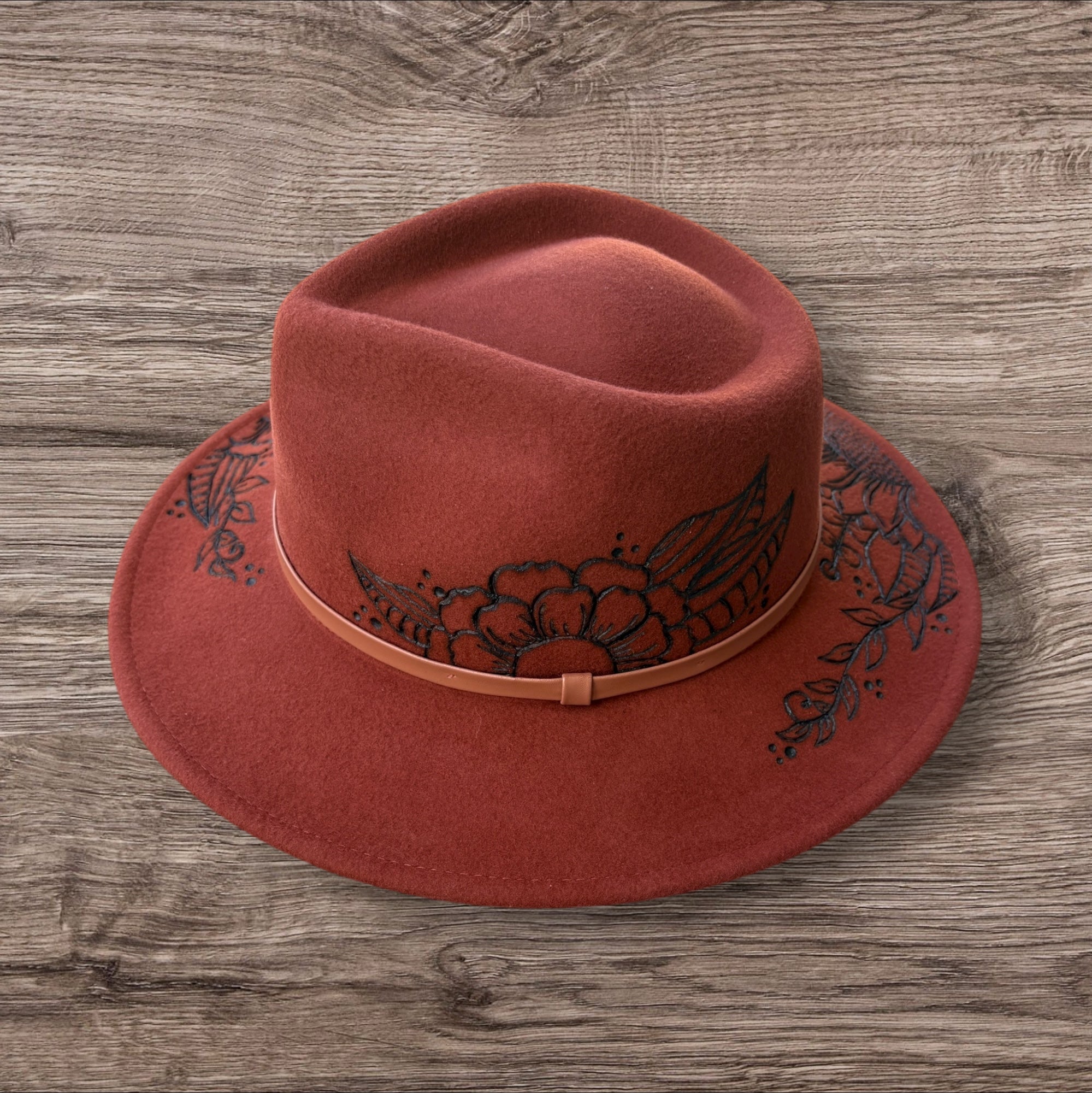 Terracotta Fedora-100% wool. Burnt Flowers with ‘A flower blossoms for its own joy’ quote underneath brim.
