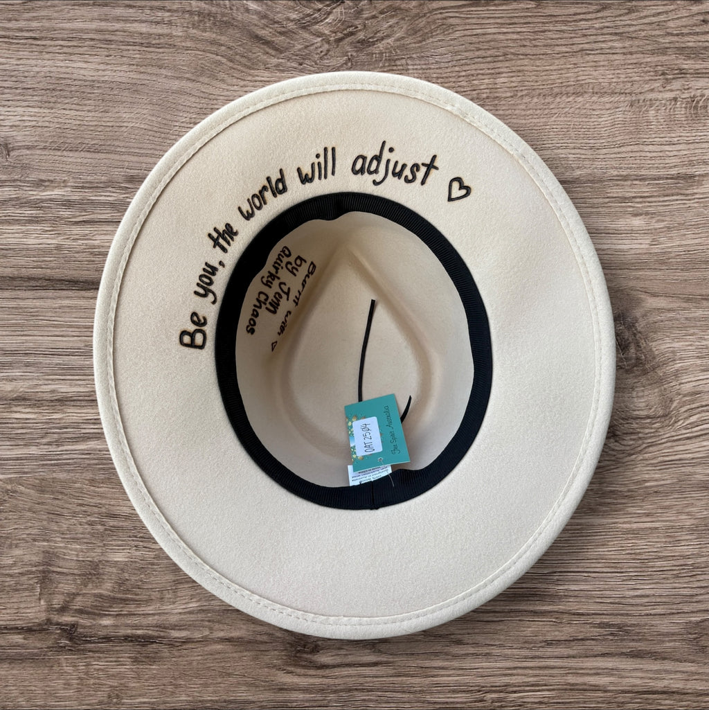 Oatmeal Fedora- 100% wool. Burnt Mandela with ‘be you, the world will adjust’ quote underneath brim.