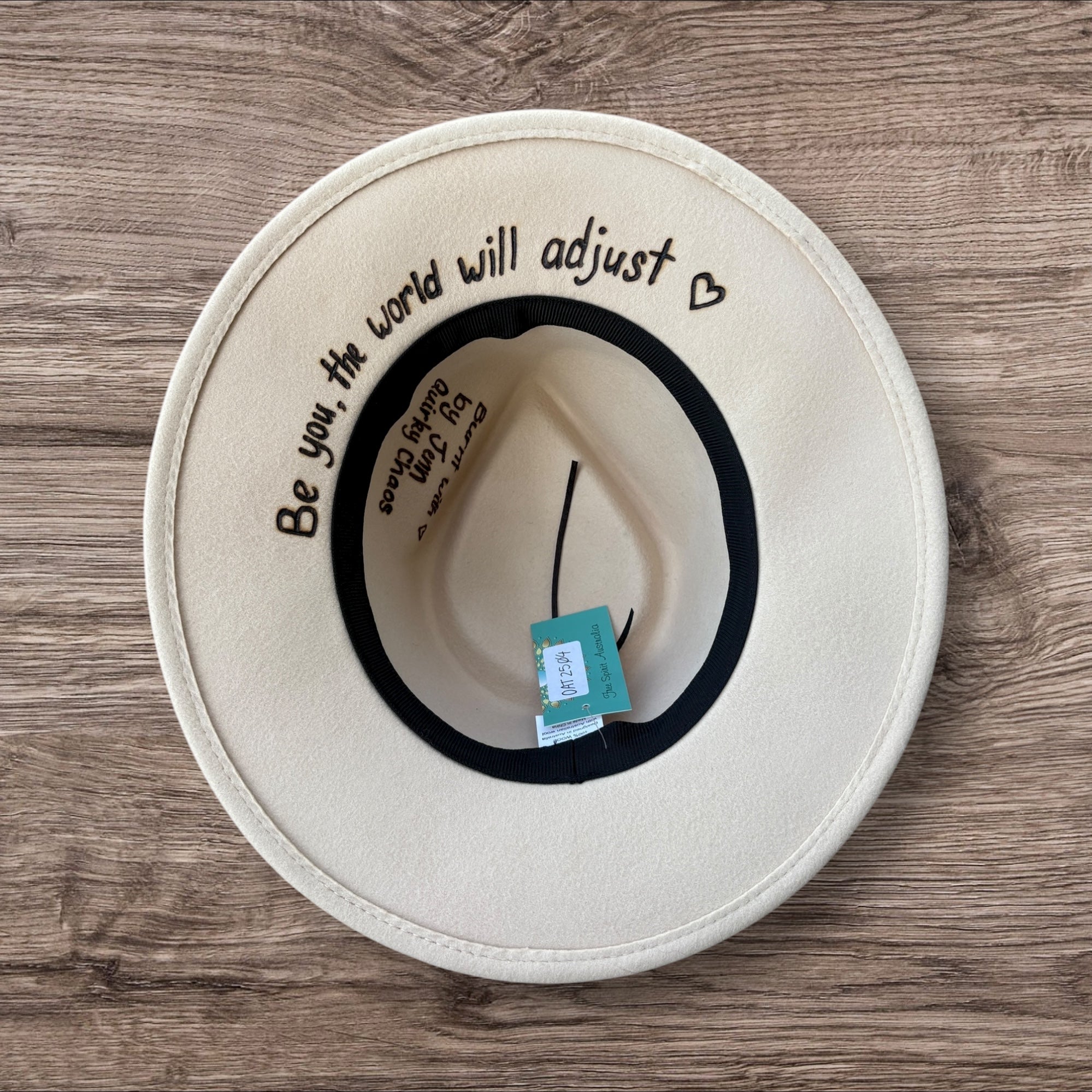 Oatmeal Fedora- 100% wool. Burnt Mandela with ‘be you, the world will adjust’ quote underneath brim.