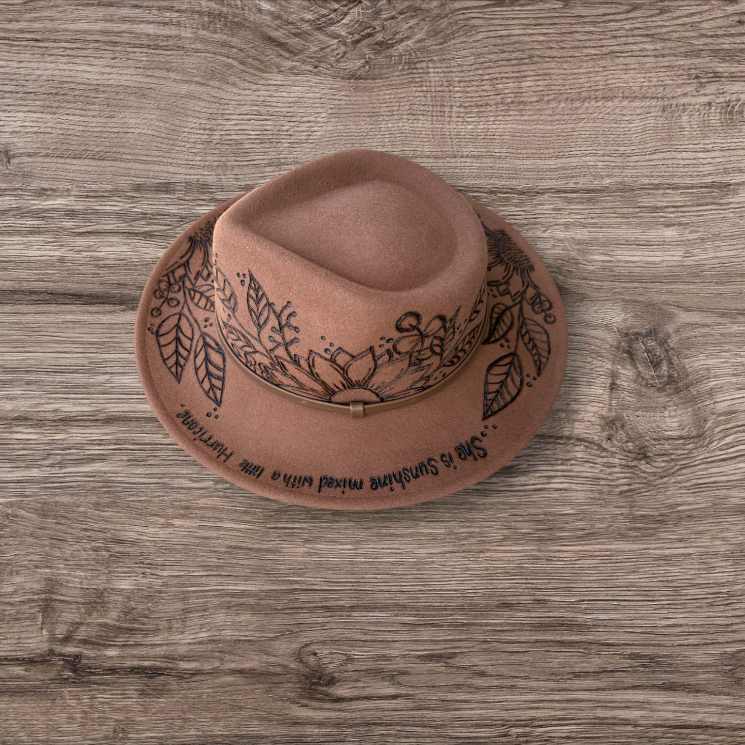 Tan Fedora- 100% wool. Pyrography Sunflowers and ‘she is sunshine mixed with a little hurricane.’ quote.