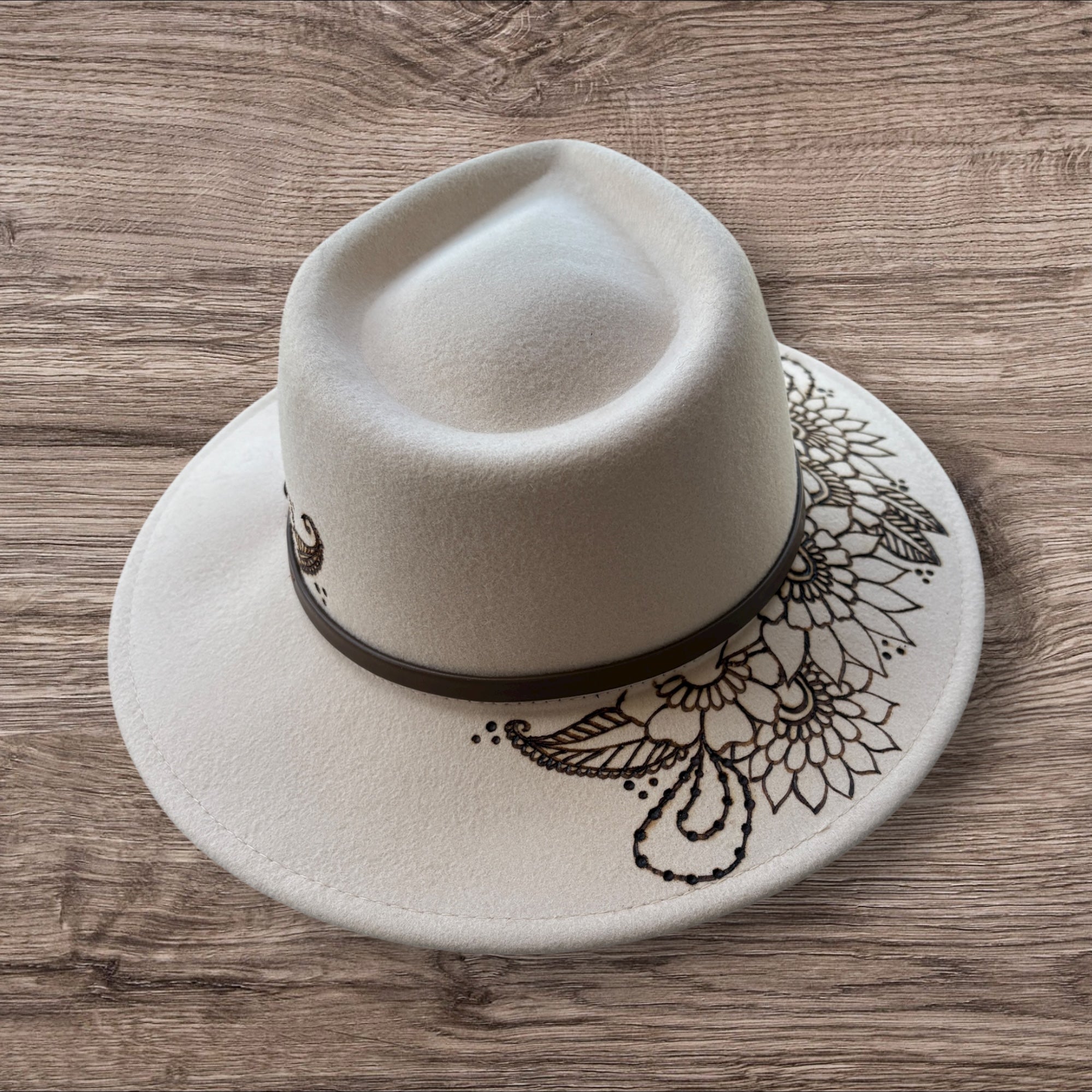 Oatmeal Fedora- 100% wool. Burnt Mandela with ‘be you, the world will adjust’ quote underneath brim.