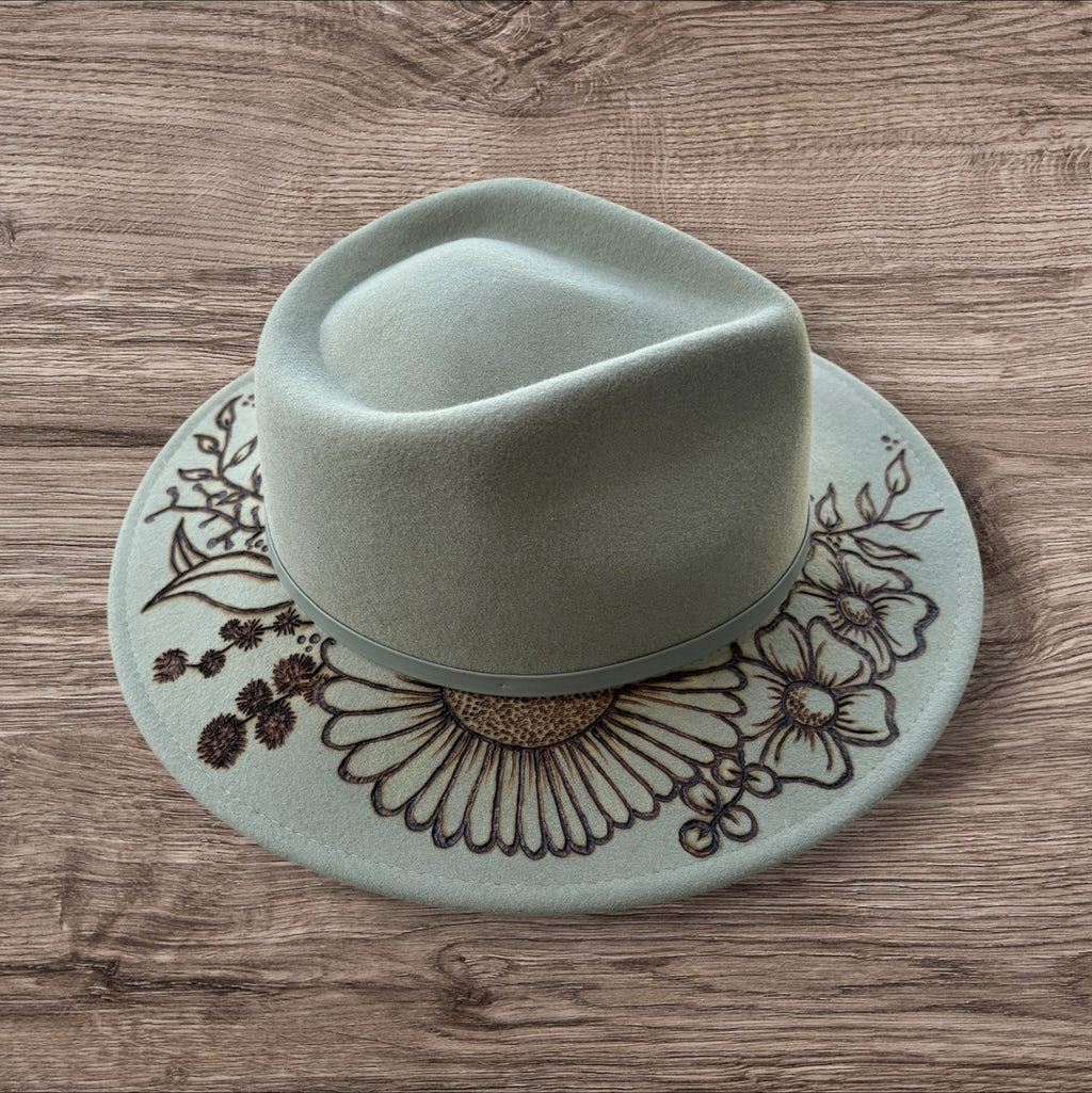 Mint Fedora - 100% wool. With pyrography flowers and  ‘Every flower blooms on its own time’ quote on underside of brim.