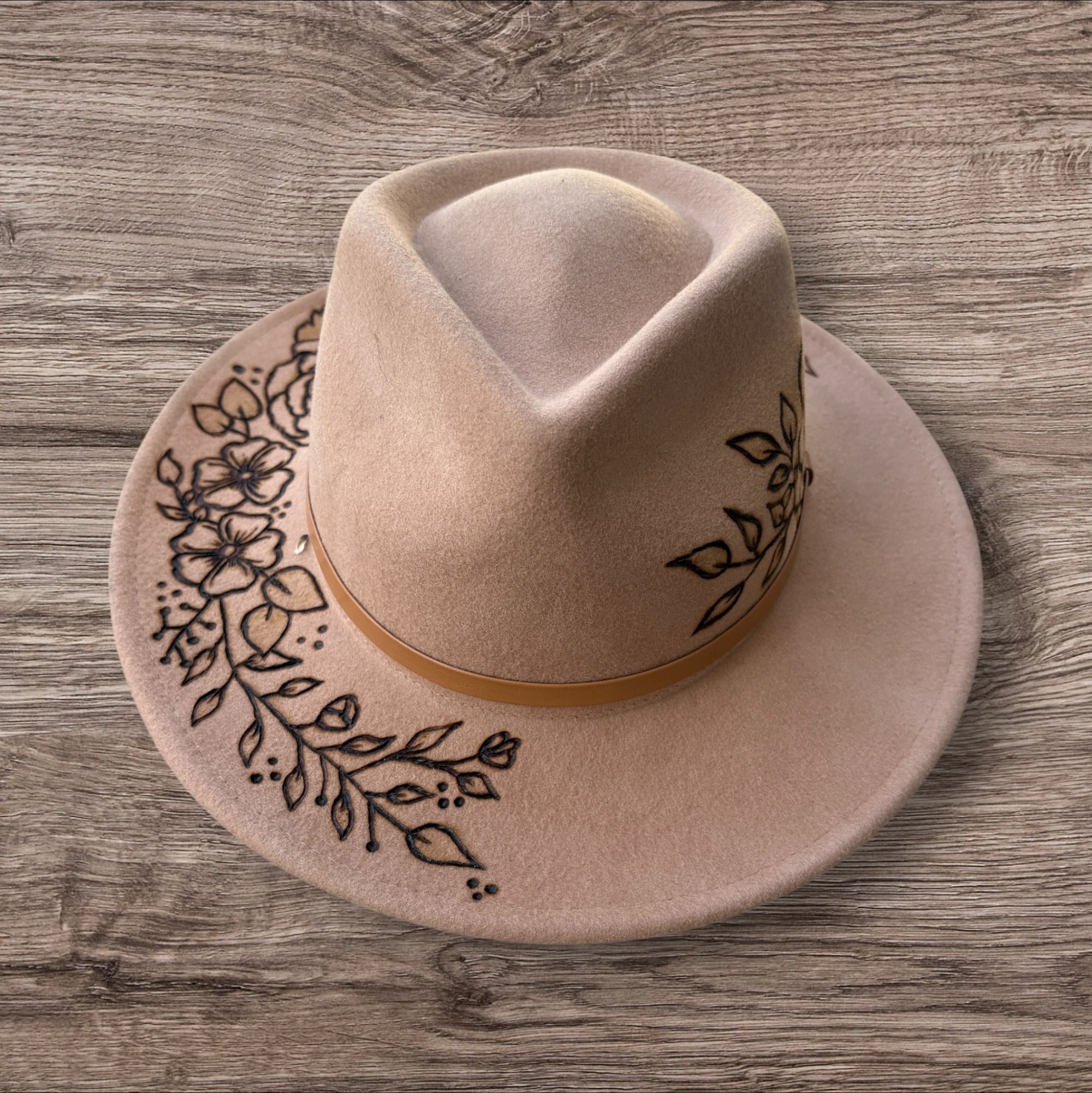 Camel Fedora- 100% wool. Pyrography flowers with ‘nothing is impossible even the word itself says ‘I’m possible!’’ Quote underneath brim.