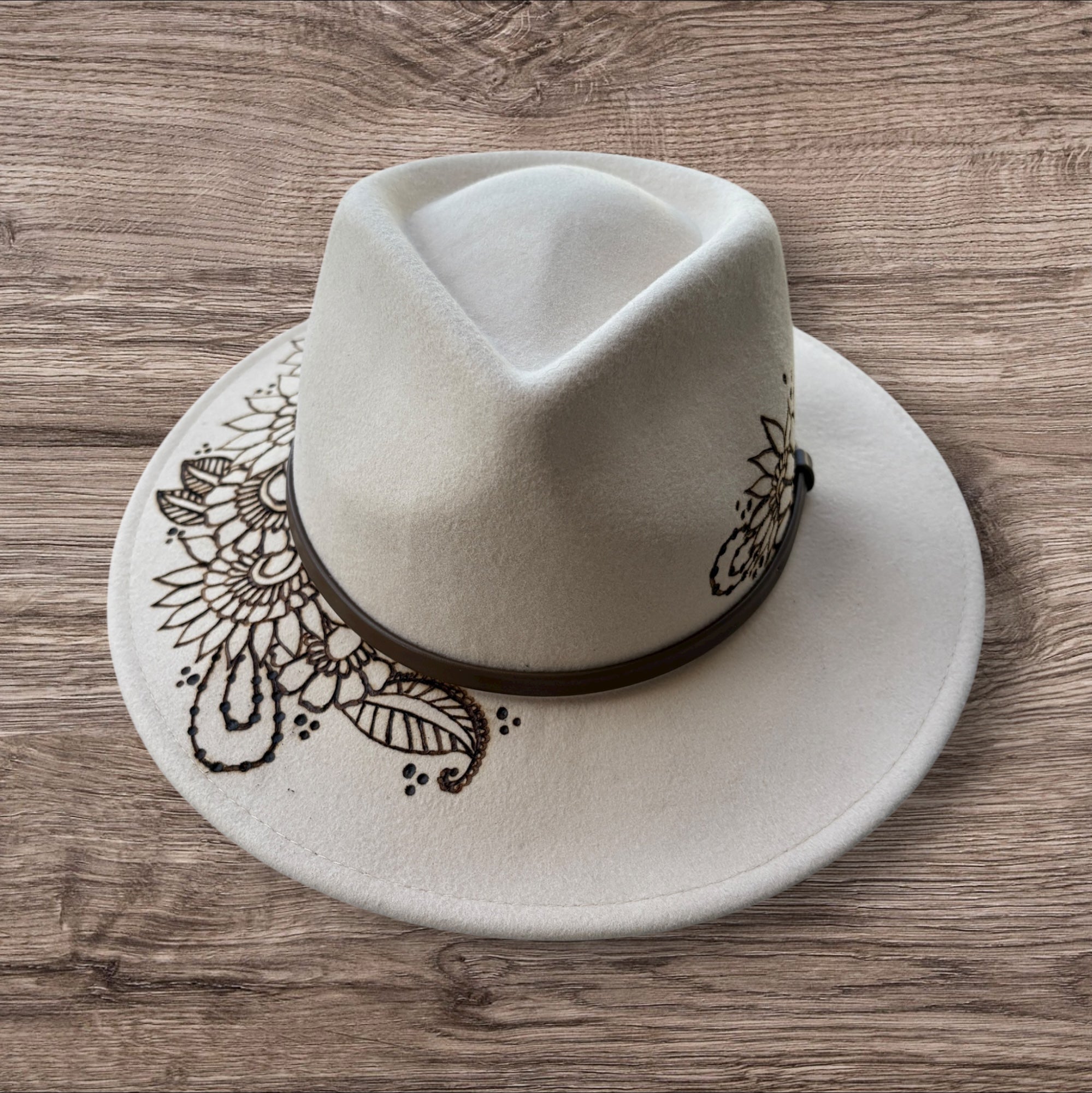 Oatmeal Fedora- 100% wool. Burnt Mandela with ‘be you, the world will adjust’ quote underneath brim.