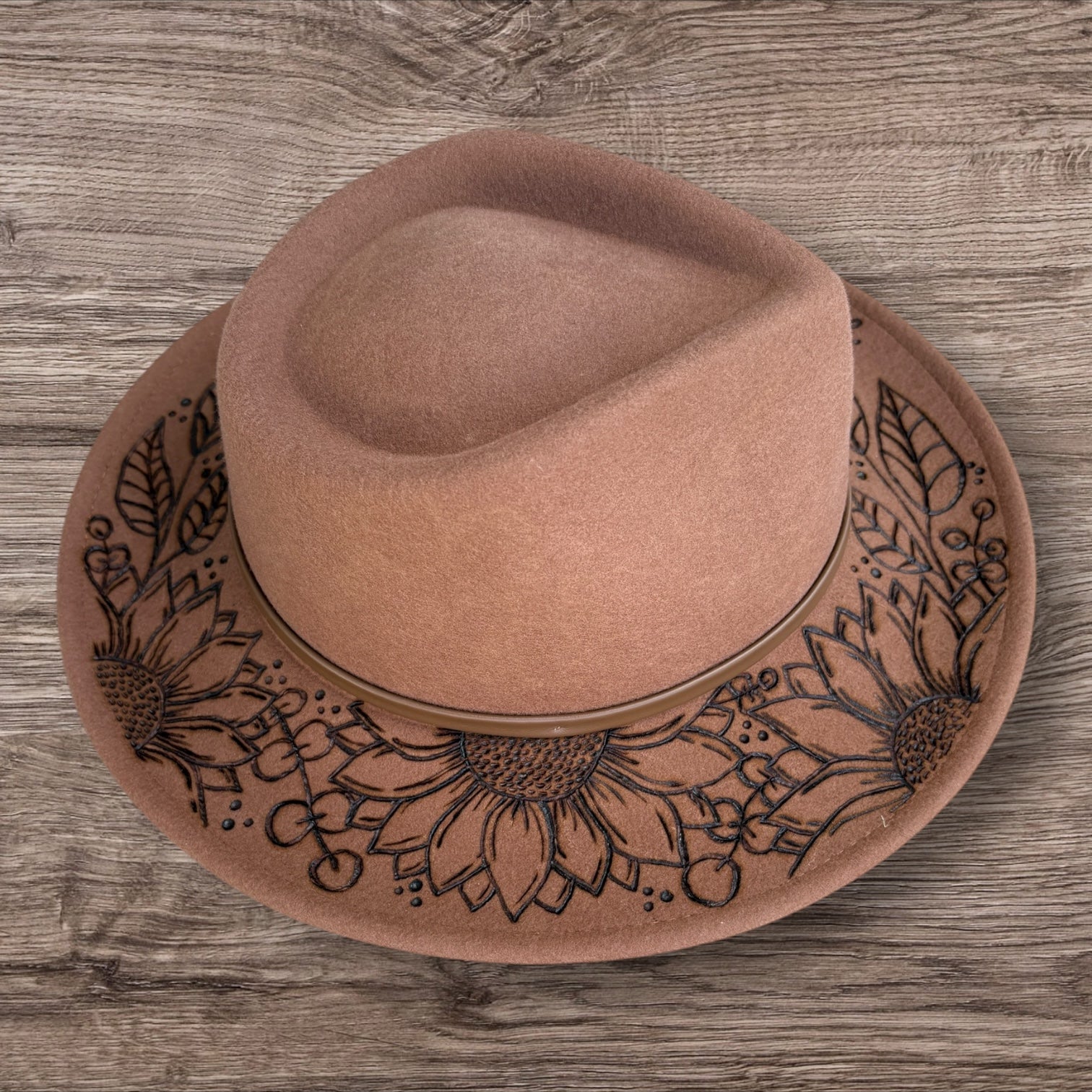 Tan Fedora- 100% wool. Pyrography Sunflowers and ‘she is sunshine mixed with a little hurricane.’ quote.