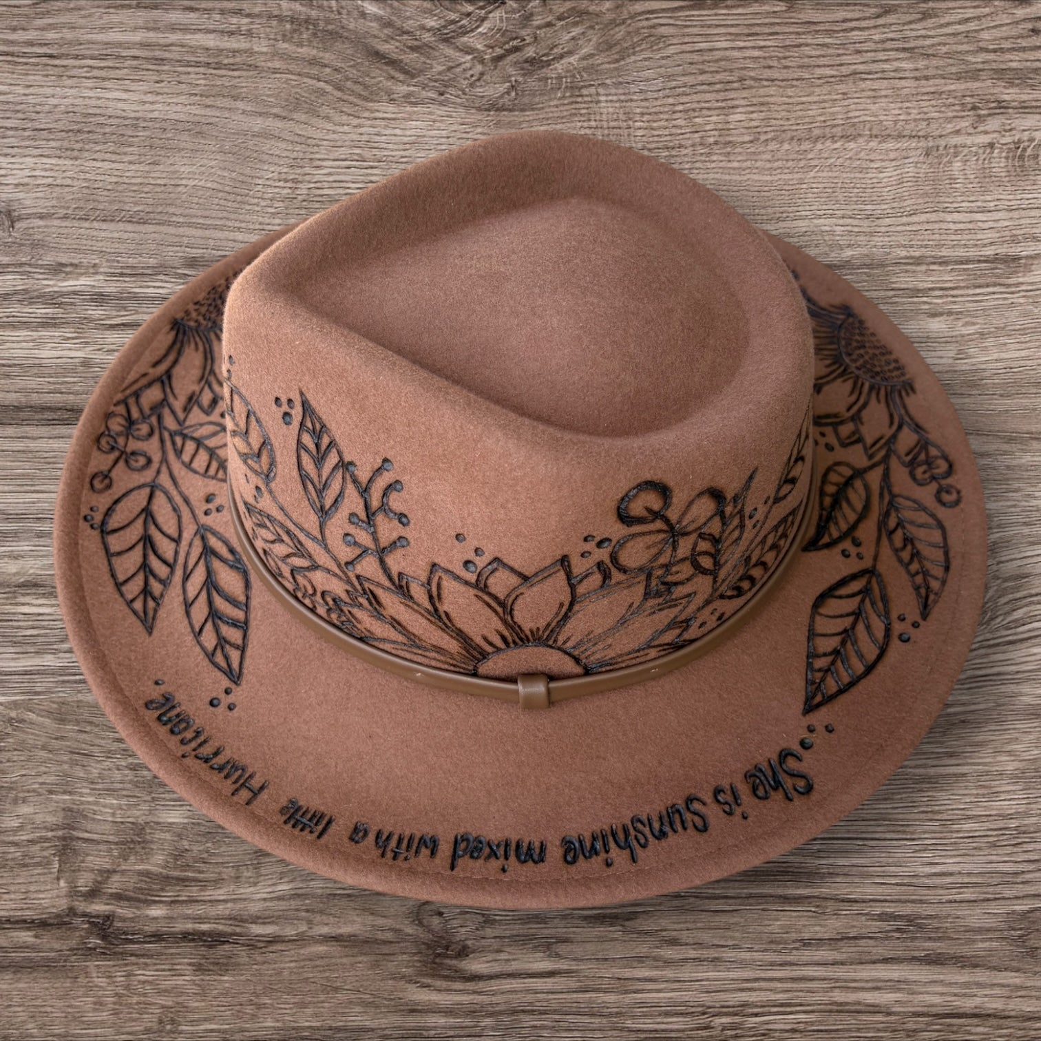 Tan Fedora- 100% wool. Pyrography Sunflowers and ‘she is sunshine mixed with a little hurricane.’ quote.