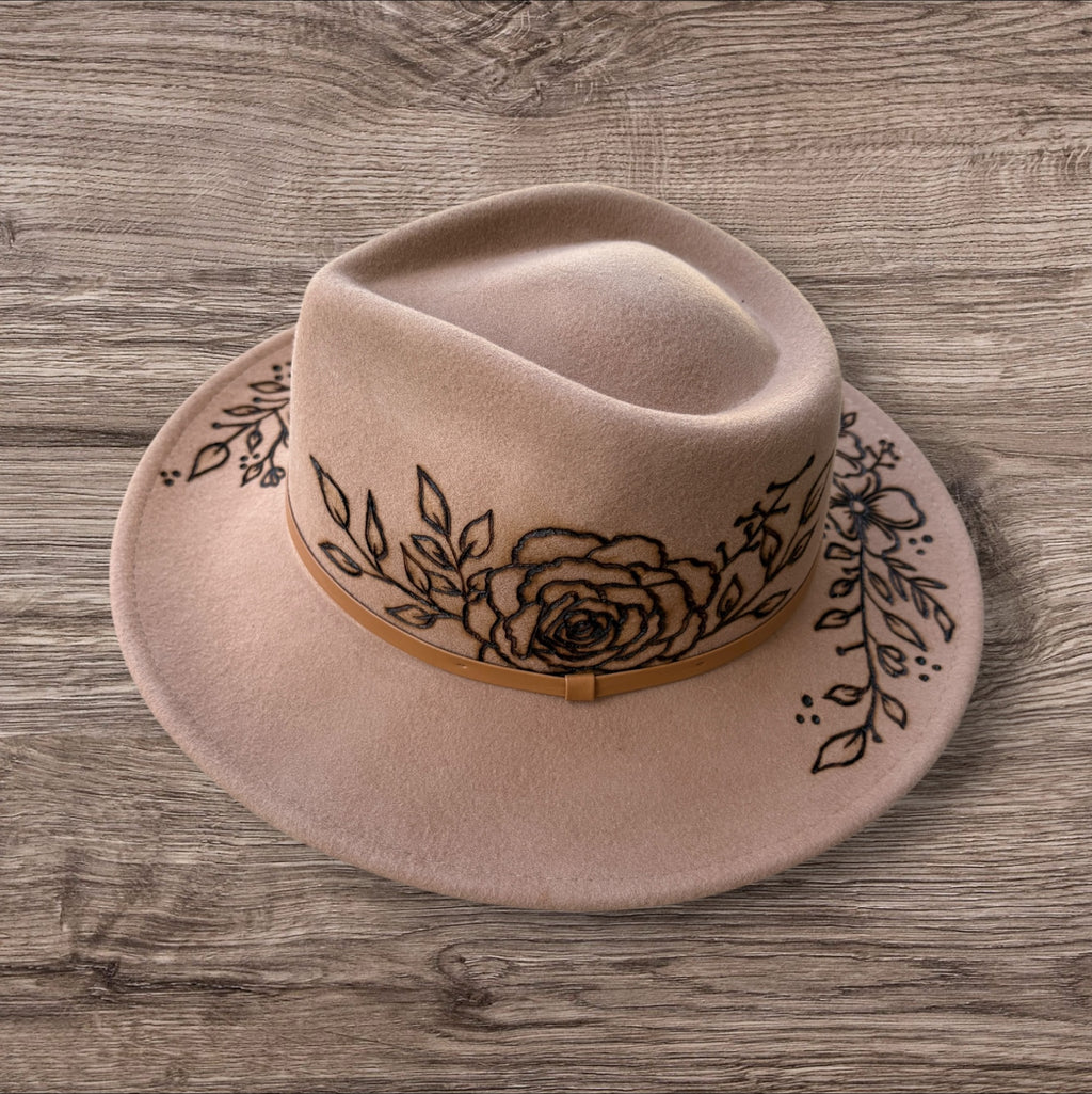 Camel Fedora- 100% wool. Pyrography flowers with ‘nothing is impossible even the word itself says ‘I’m possible!’’ Quote underneath brim.