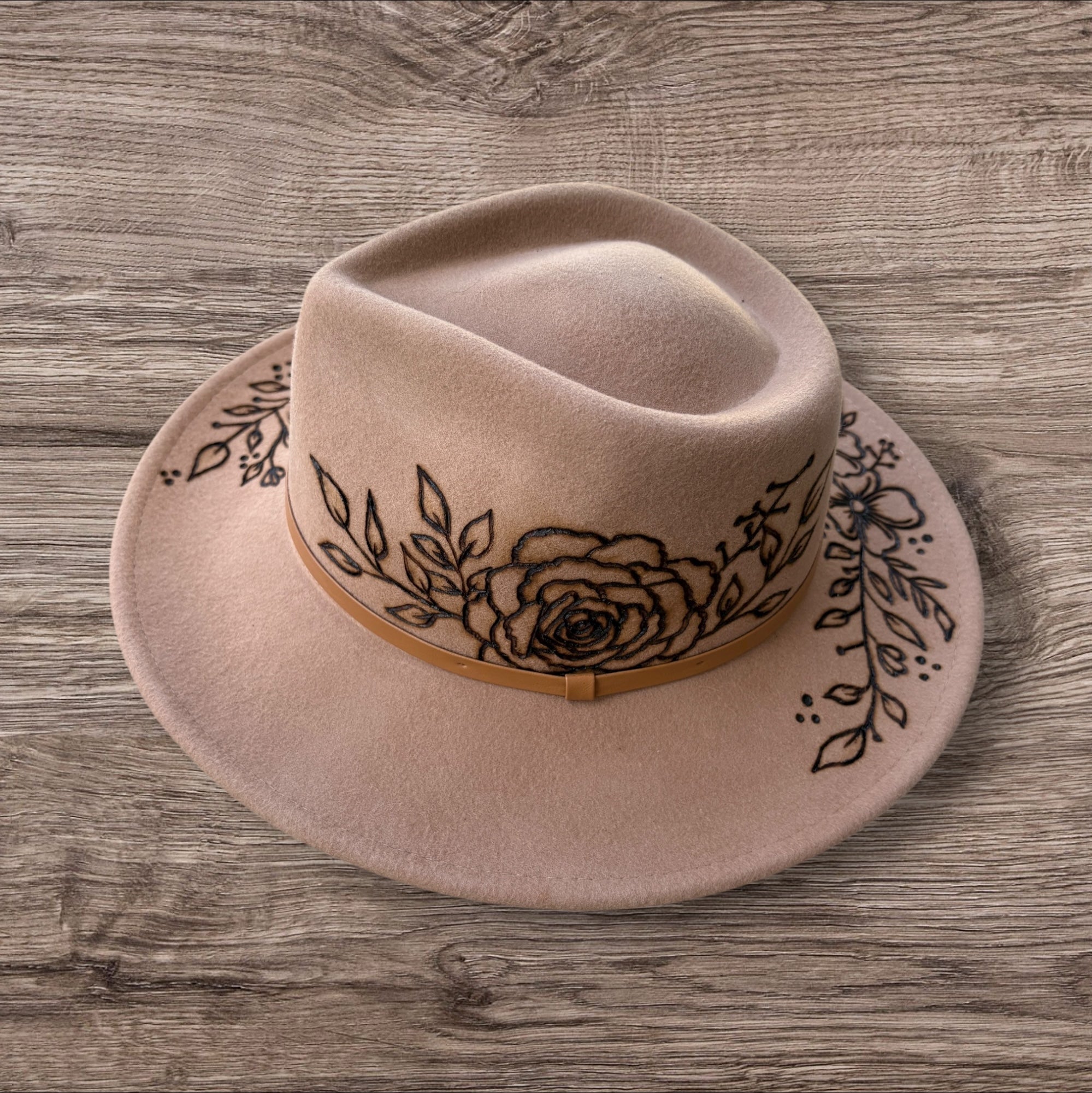 Camel Fedora- 100% wool. Pyrography flowers with ‘nothing is impossible even the word itself says ‘I’m possible!’’ Quote underneath brim.