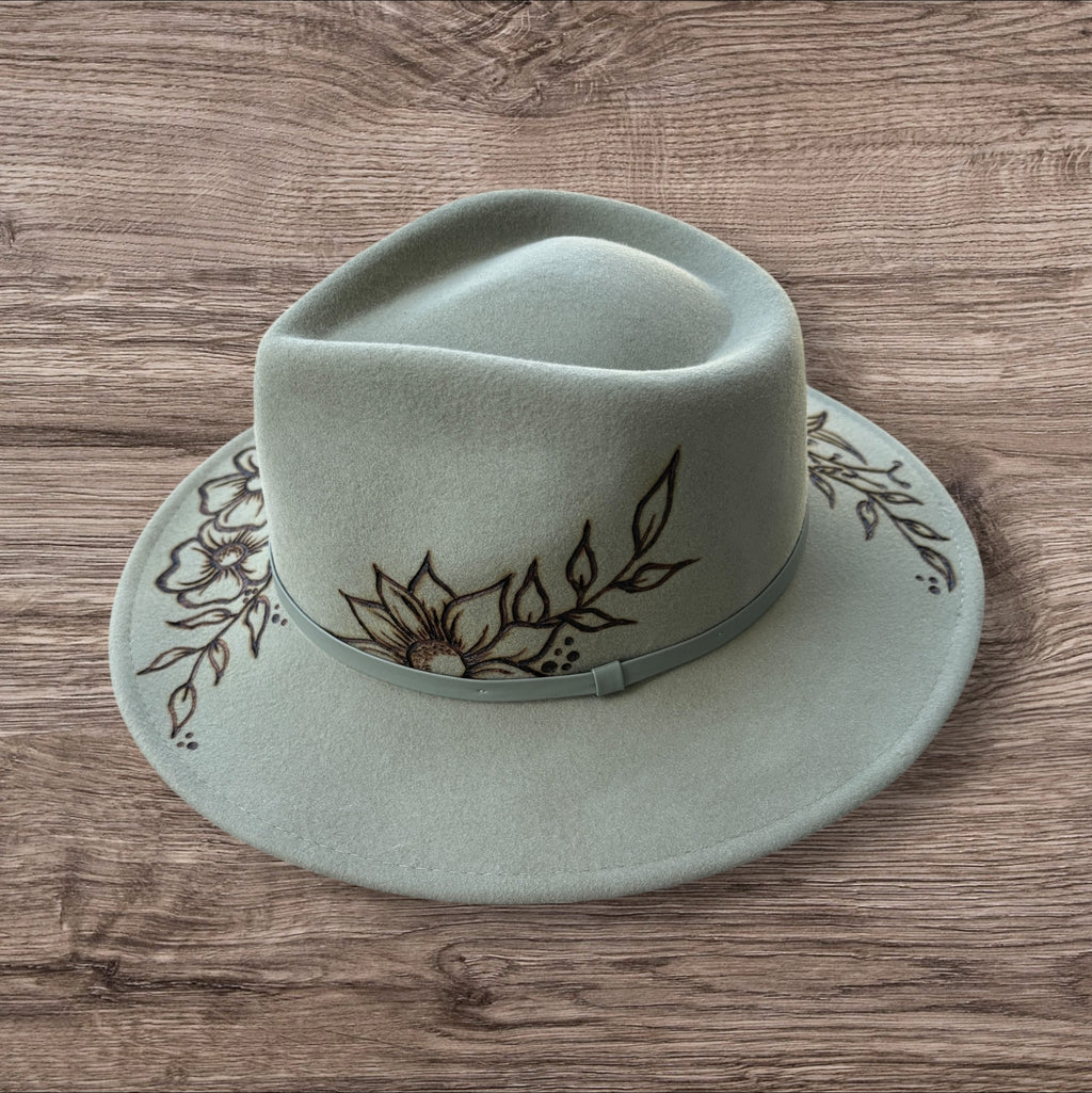 Mint Fedora - 100% wool. With pyrography flowers and  ‘Every flower blooms on its own time’ quote on underside of brim.