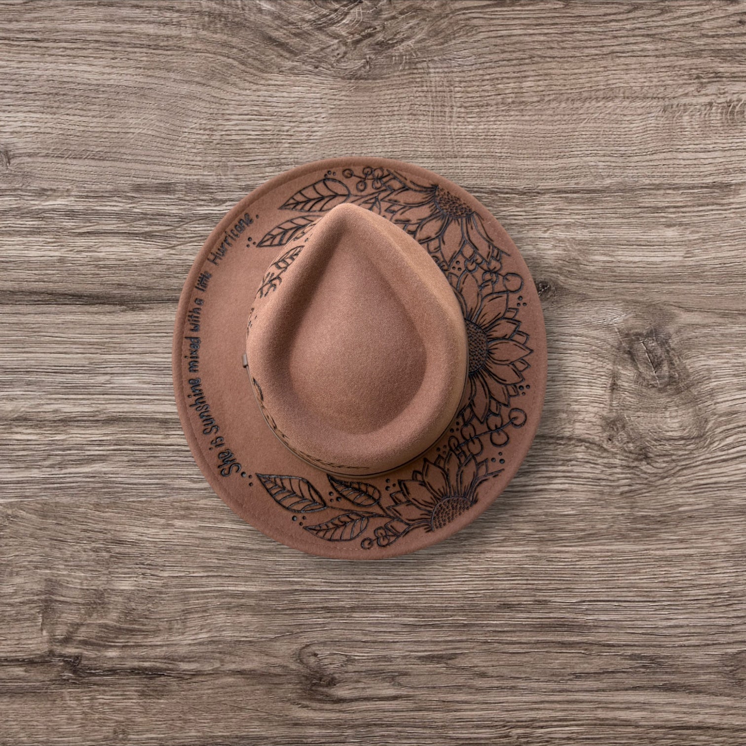 Tan Fedora- 100% wool. Pyrography Sunflowers and ‘she is sunshine mixed with a little hurricane.’ quote.