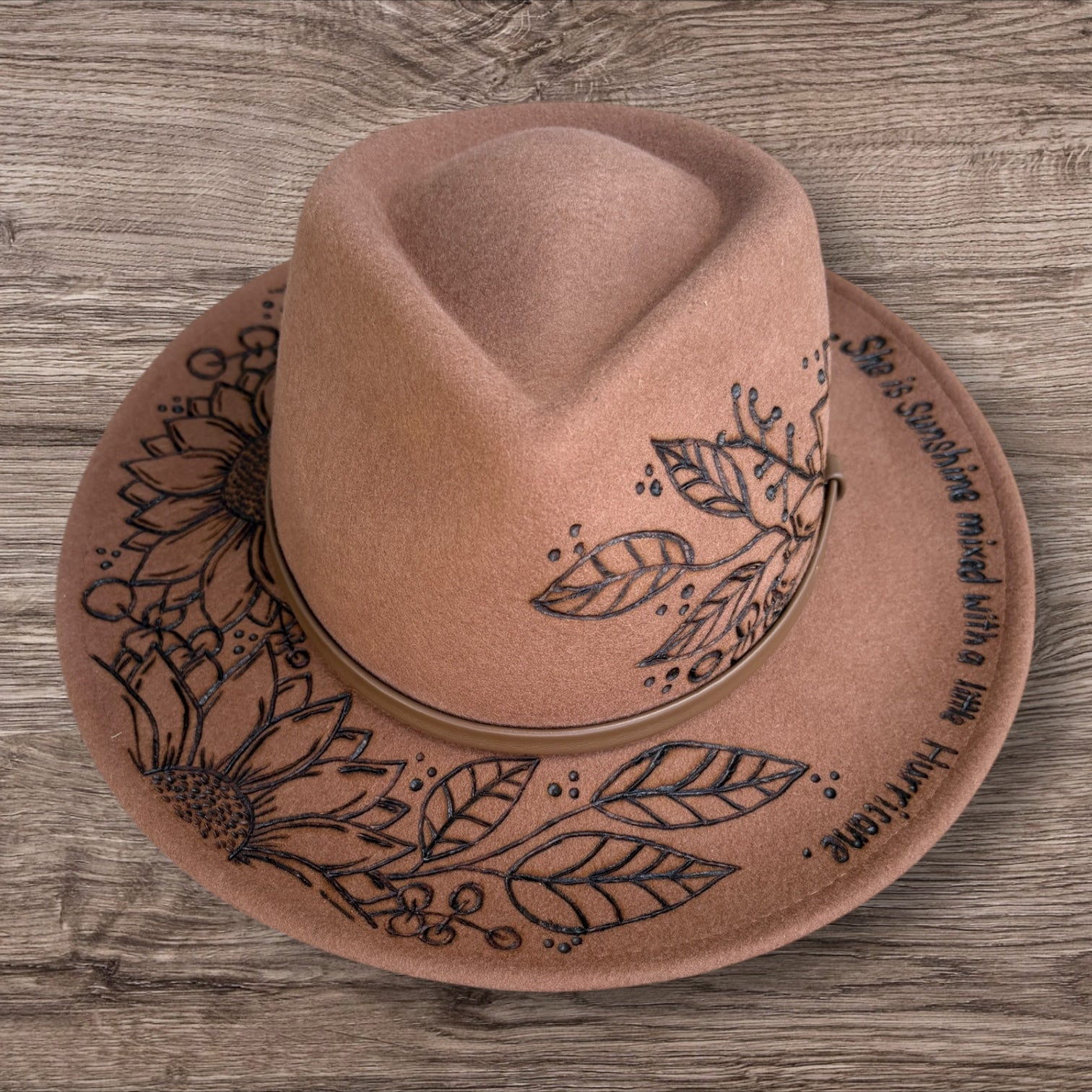 Tan Fedora- 100% wool. Pyrography Sunflowers and ‘she is sunshine mixed with a little hurricane.’ quote.