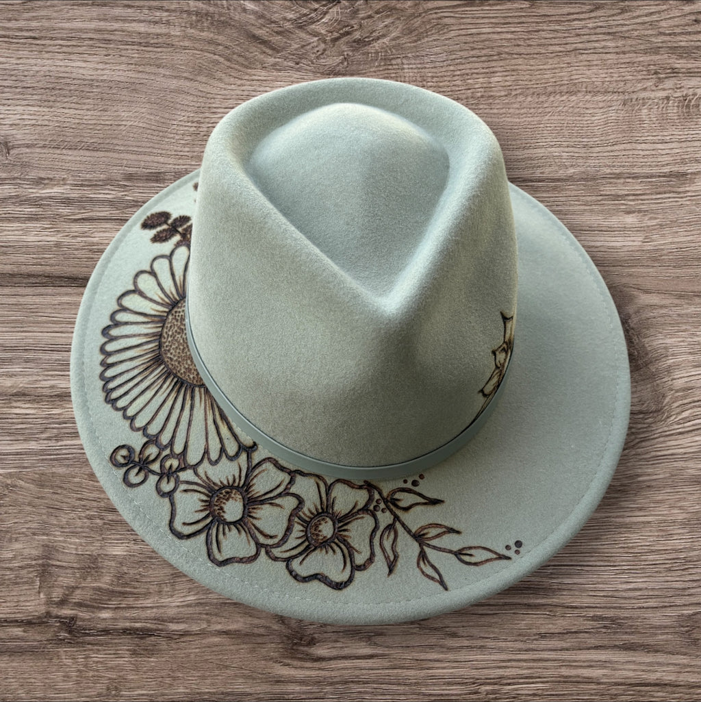 Mint Fedora - 100% wool. With pyrography flowers and  ‘Every flower blooms on its own time’ quote on underside of brim.