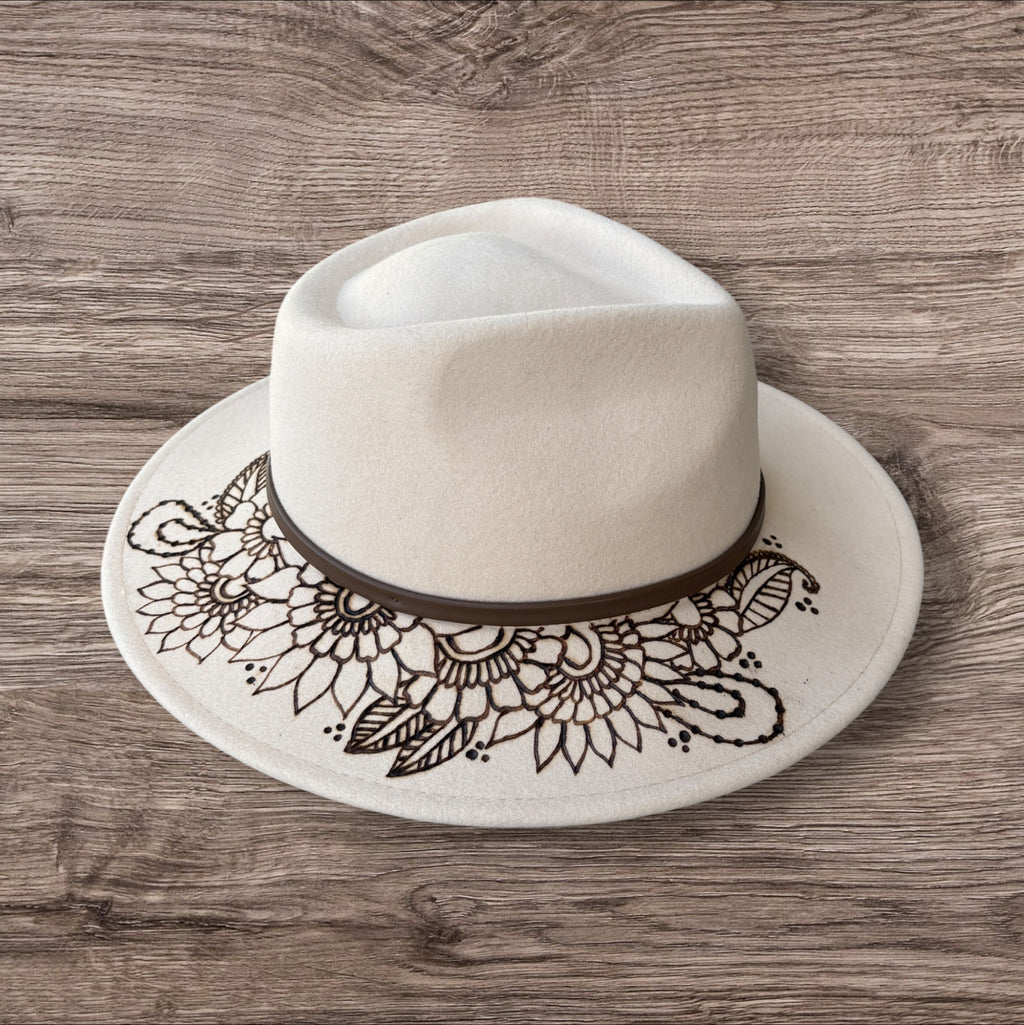 Oatmeal Fedora- 100% wool. Burnt Mandela with ‘be you, the world will adjust’ quote underneath brim.