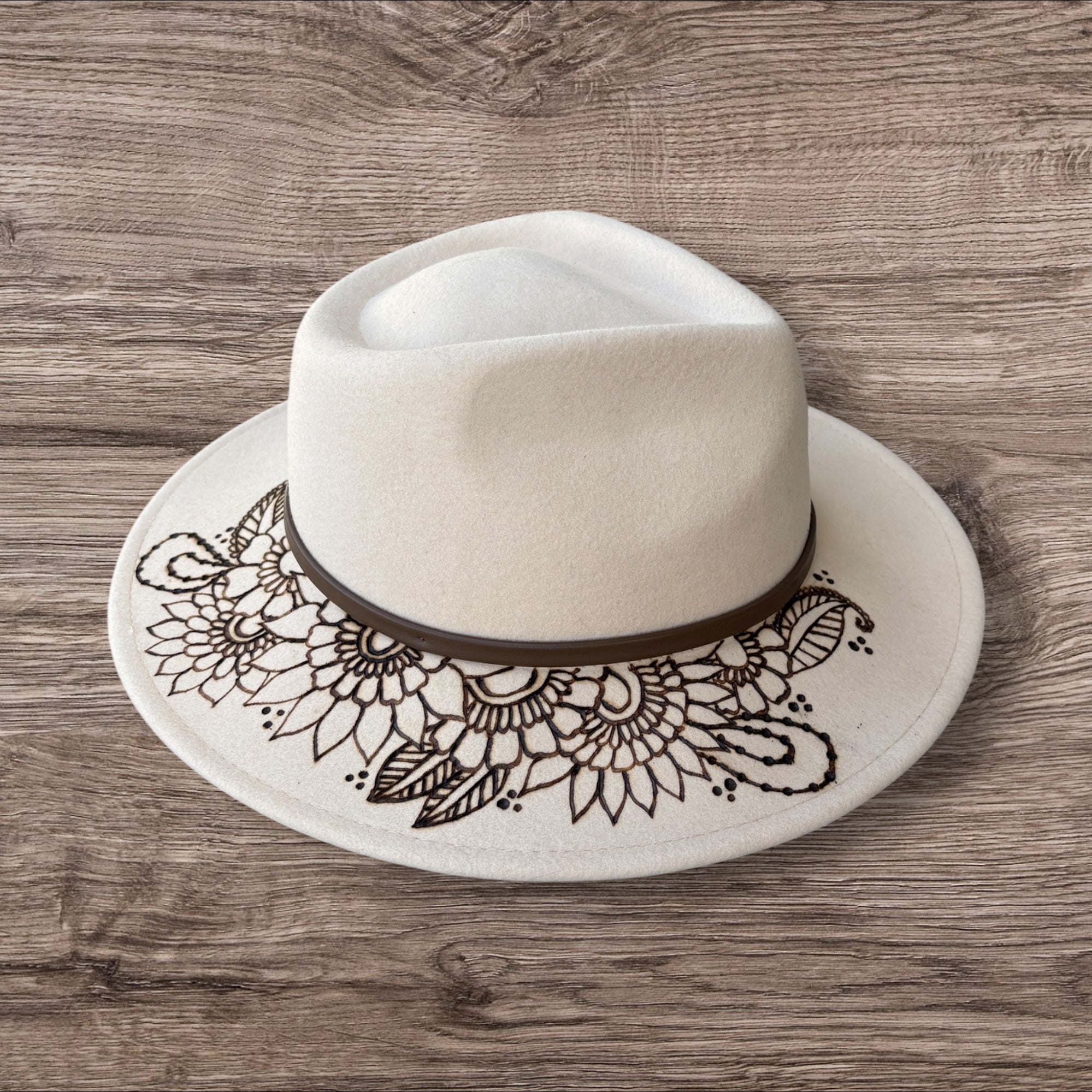 Oatmeal Fedora- 100% wool. Burnt Mandela with ‘be you, the world will adjust’ quote underneath brim.